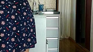 Canadian milf maid flashes huge tits legs in see-through dress kitchen morning?