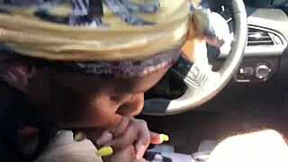 Black hooker slurps white cock in car.