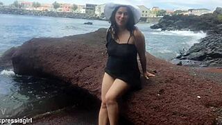 Curvy brunette milf flashes big pussy lips tits on beach public photoshoot solo