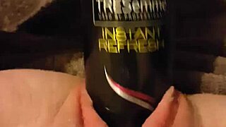 Young slut stretches gaping pussy with huge hairspray can!!!