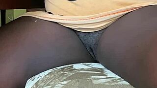 Naughty ebony mature flashes her wet pussy at home