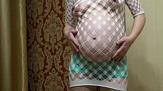 pregnant russian milf in stockings shoves panties aside to fuck hairy pussy with dildo