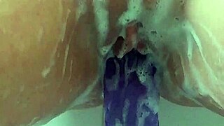 FUCK, I'M THRUSTING MY BIG PURPLE DILDO DEEP IN THE BATH TILL MY PUSSY EXPLODES IN CUM!