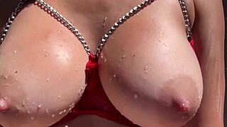 artemisia love plays with her big boobs in outdoor water fun