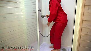 Private secretary in red latex rainsuit showers wet with boss cum on ass