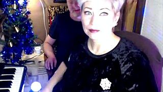 Mature married couple entertains young on balcony