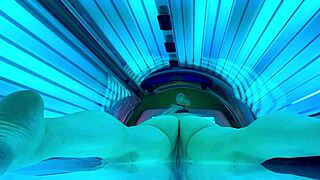 nude amateur enjoys public tanning bed session