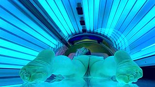nude amateur enjoys public tanning bed session