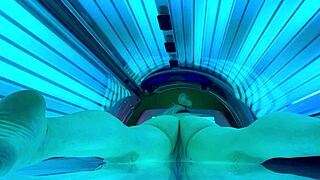 nude amateur enjoys public tanning bed session