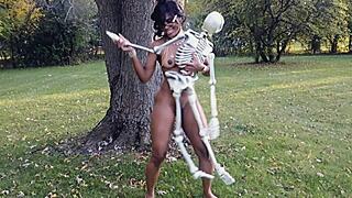 ebony milf dances naked with bones outdoors