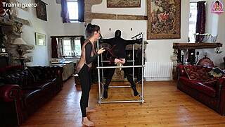 Whipping on wooden bondage for slave