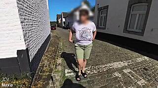 A Busty Milf Walking In The Street Braless