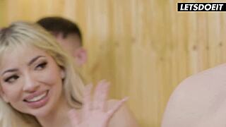 curvy blonde rides one cock while deepthroating another in the sauna